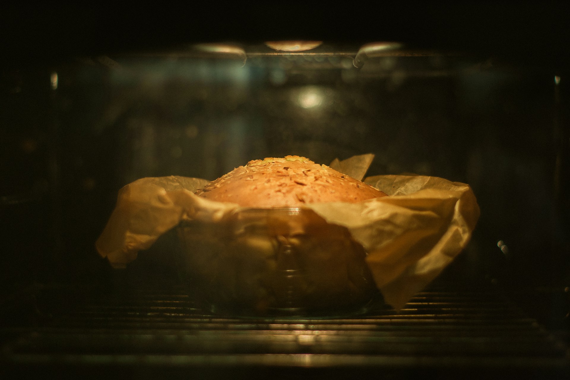 A loaf of bread is baking in the oven