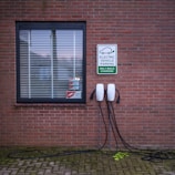 A brick building with a sign on the side of it