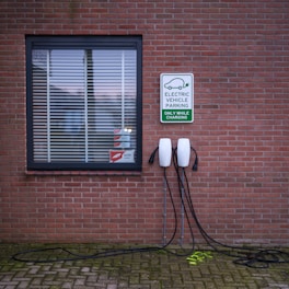 A brick building with a sign on the side of it