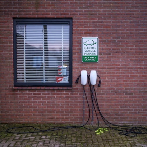 A brick building with a sign on the side of it