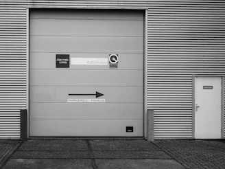 A black and white photo of a garage door