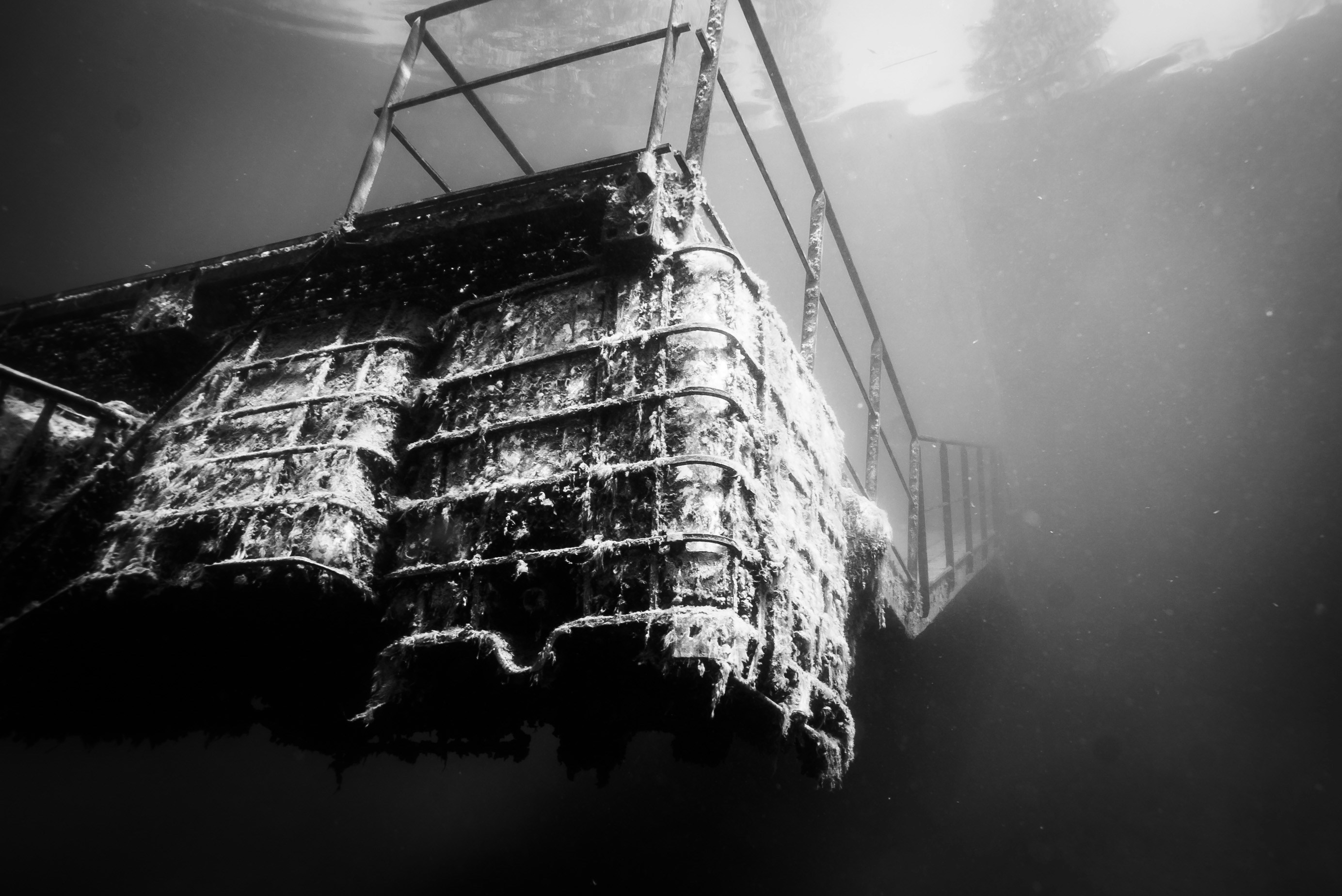 A black and white photo of a boat in the water