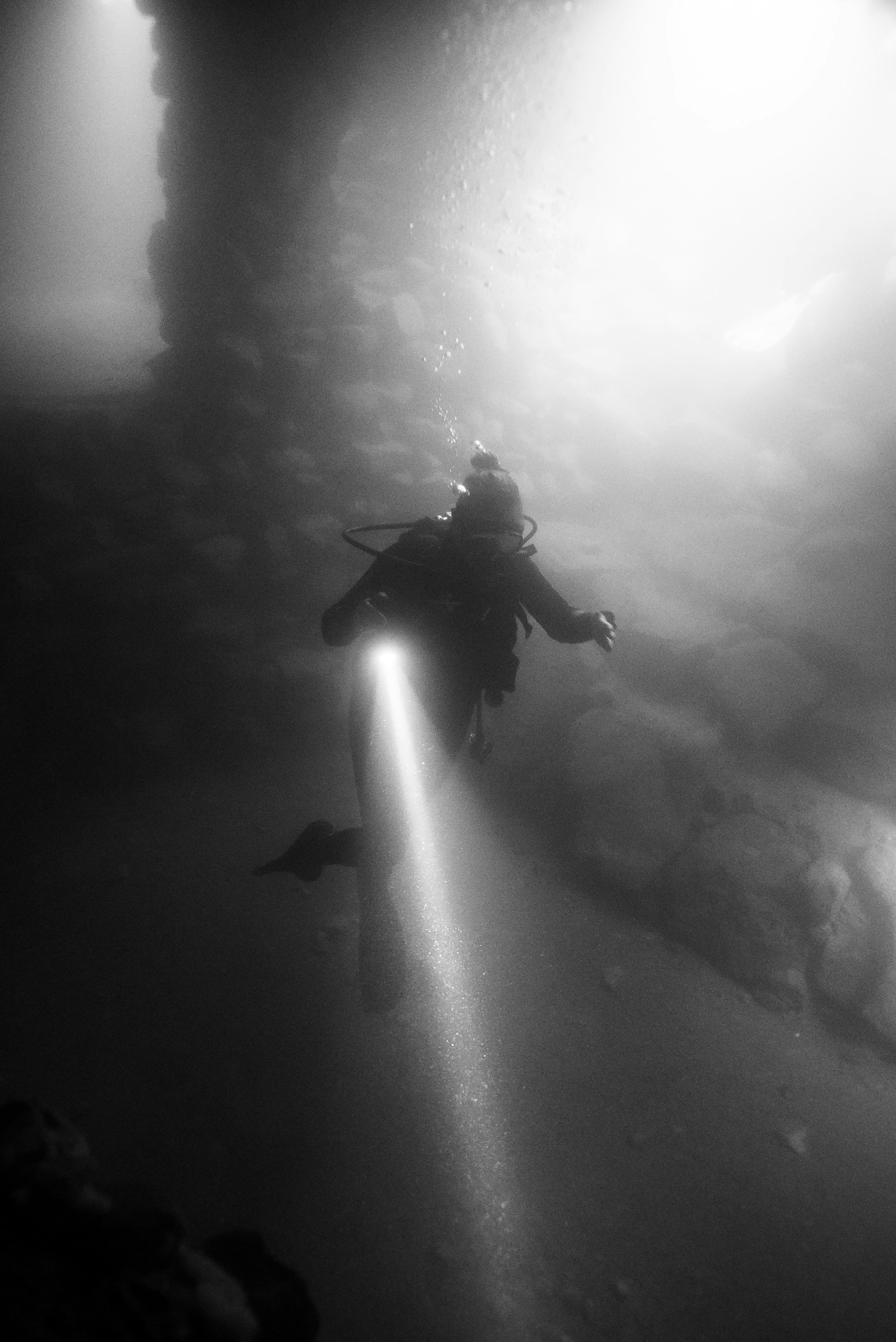 A black and white photo of a person in the air