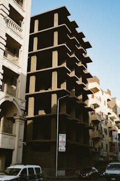 A tall building with a bunch of balconies on the side of it