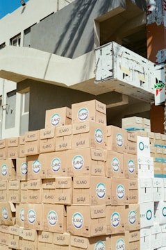 A pile of boxes sitting in front of a building
