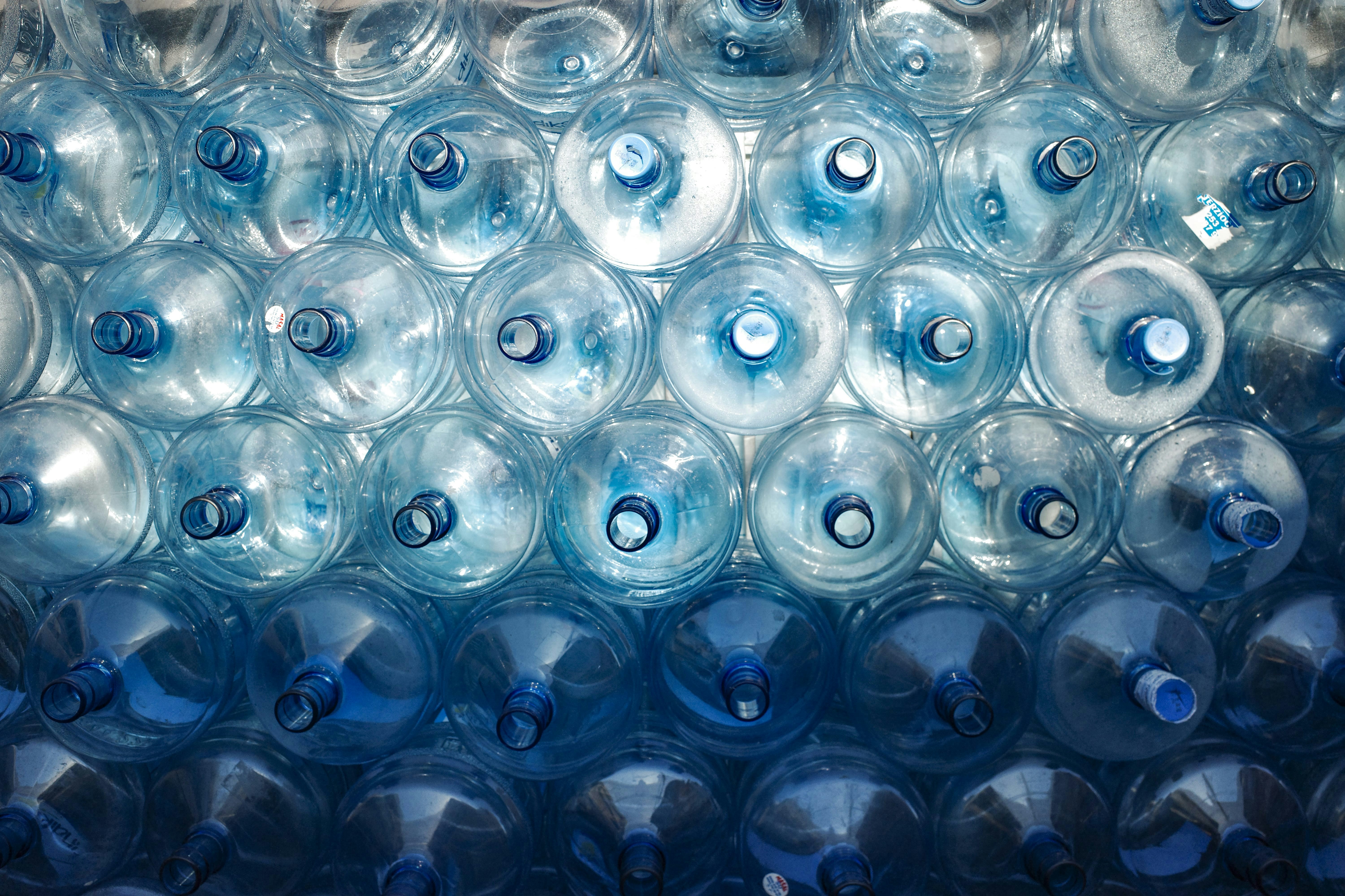 A bunch of water bottles stacked on top of each other