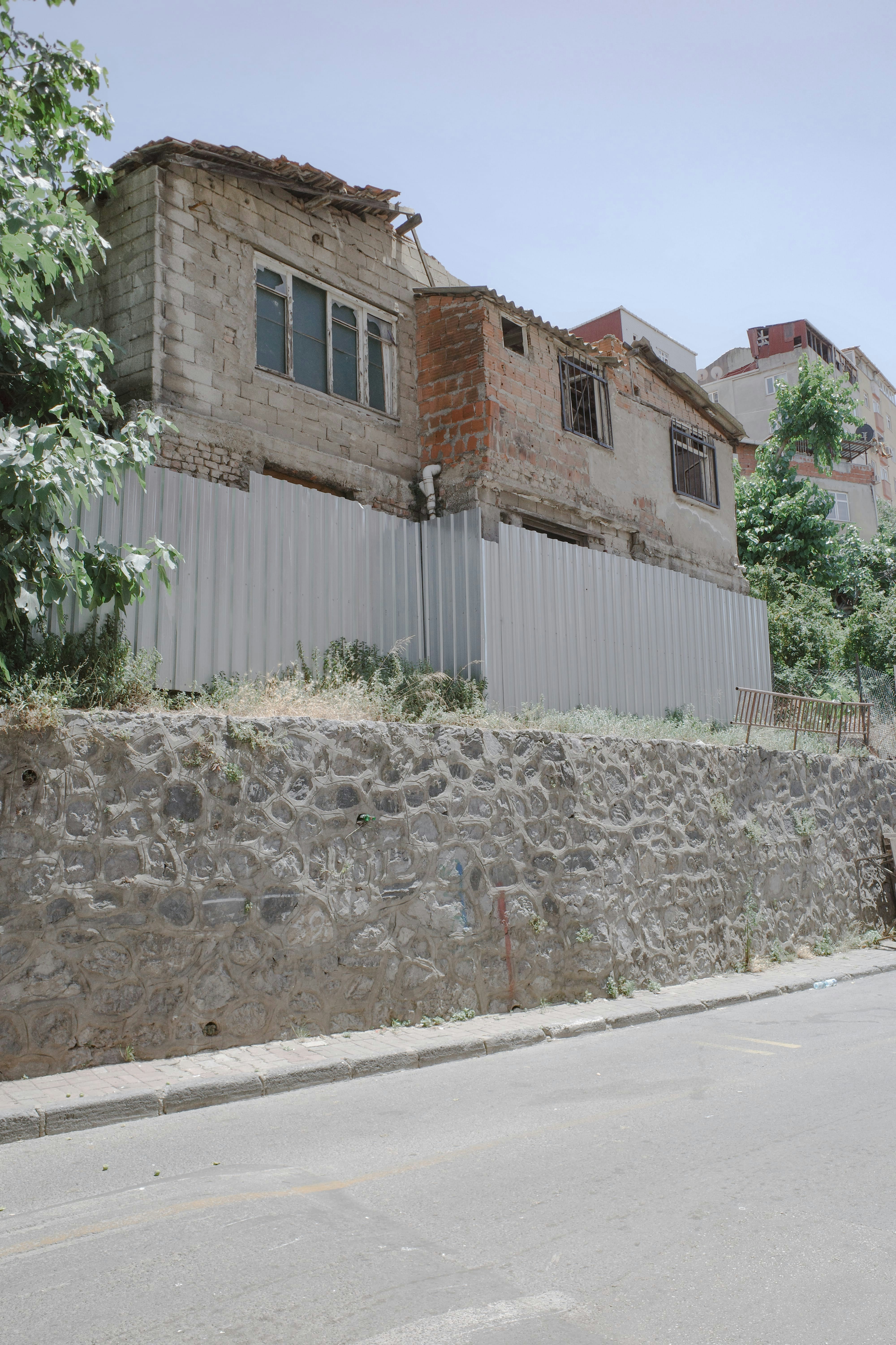 A man riding a skateboard down a street