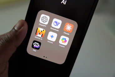 A person holding a smart phone in their hand