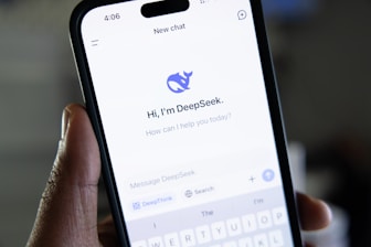 A person holding a cell phone in their hand