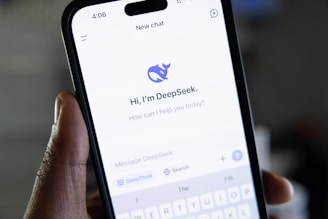 A person holding a cell phone in their hand