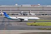 A large jetliner sitting on top of an airport tarmac