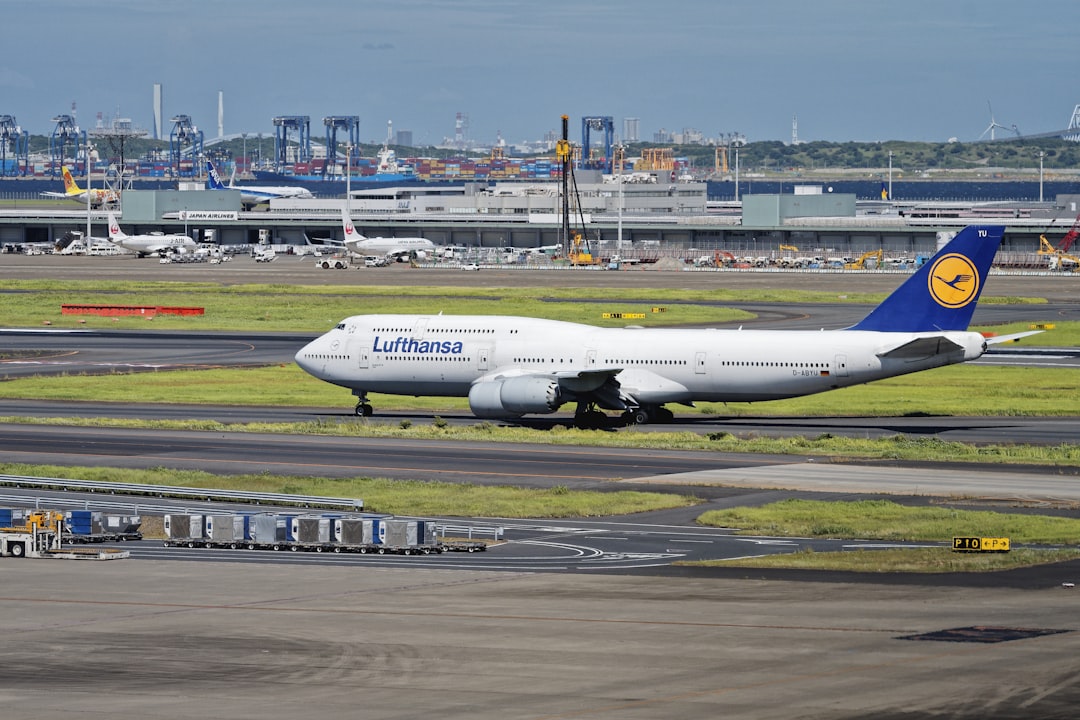 A large jetliner sitting on top of an airport runway,