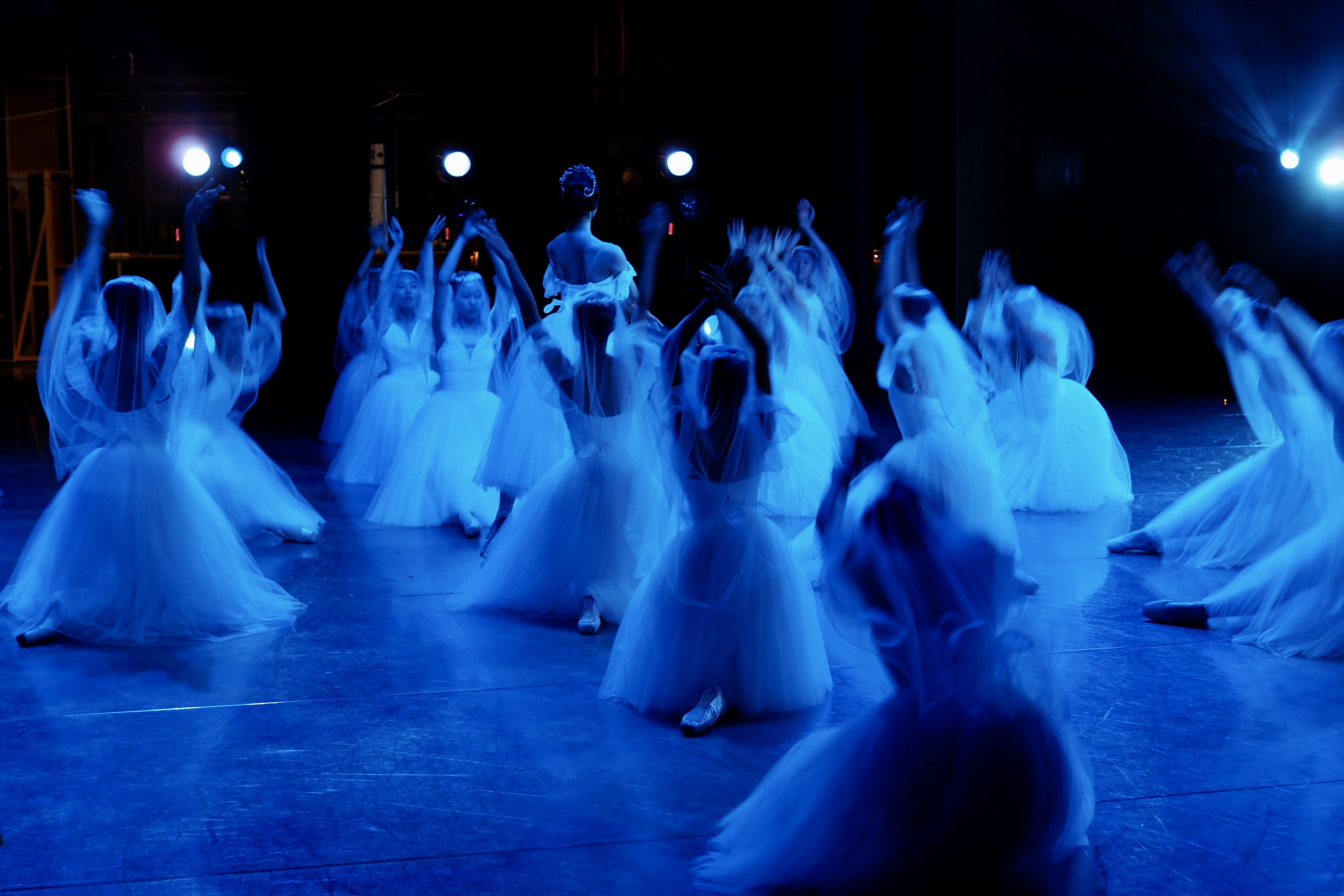 A group of people that are standing on a stage