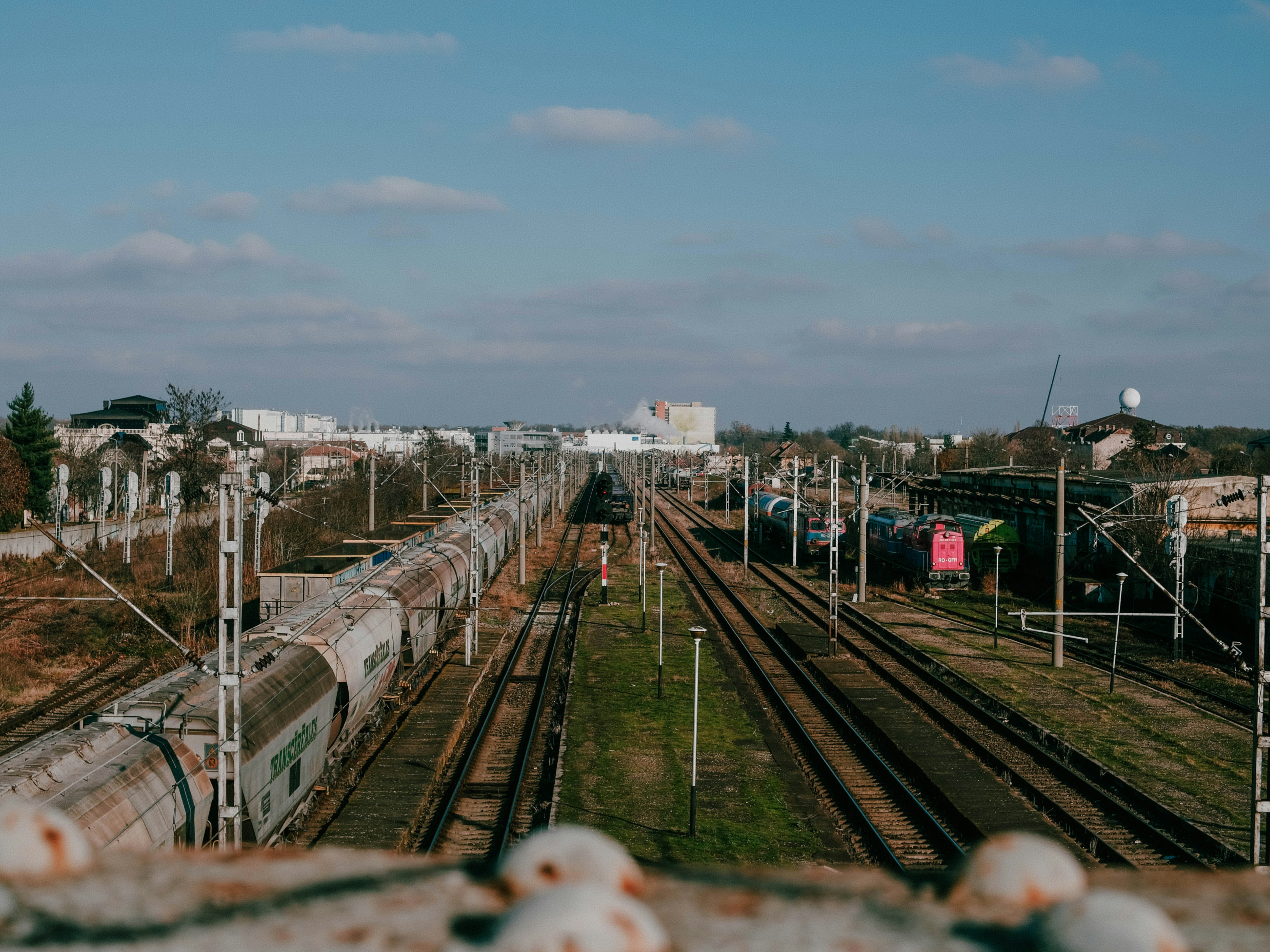 A view of a train yard from a bridge