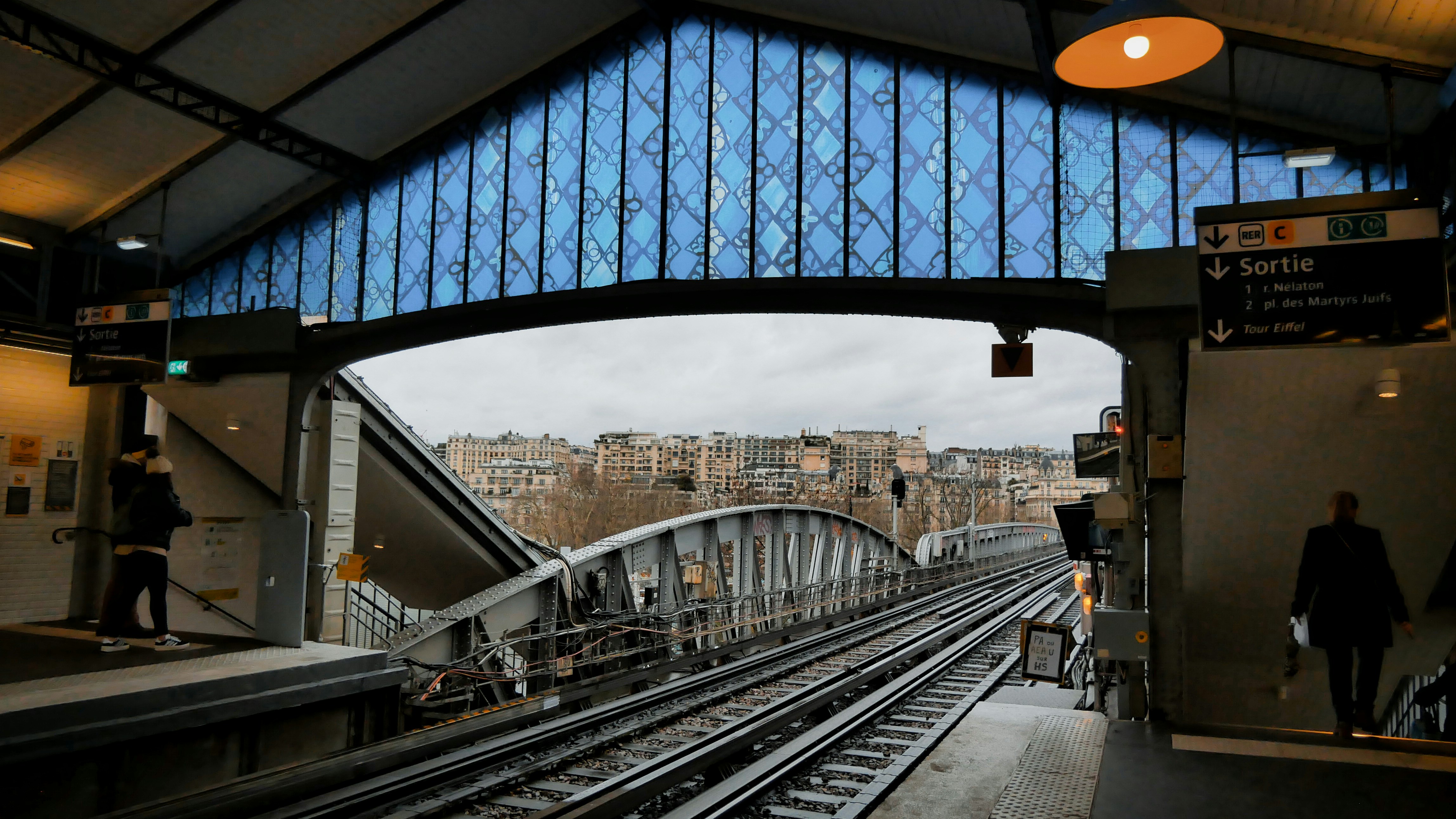A train station with a train on the tracks