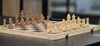 A chess board with pieces on top of it