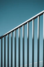 A man riding a skateboard down a metal rail