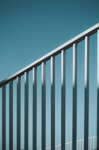 A man riding a skateboard down a metal rail