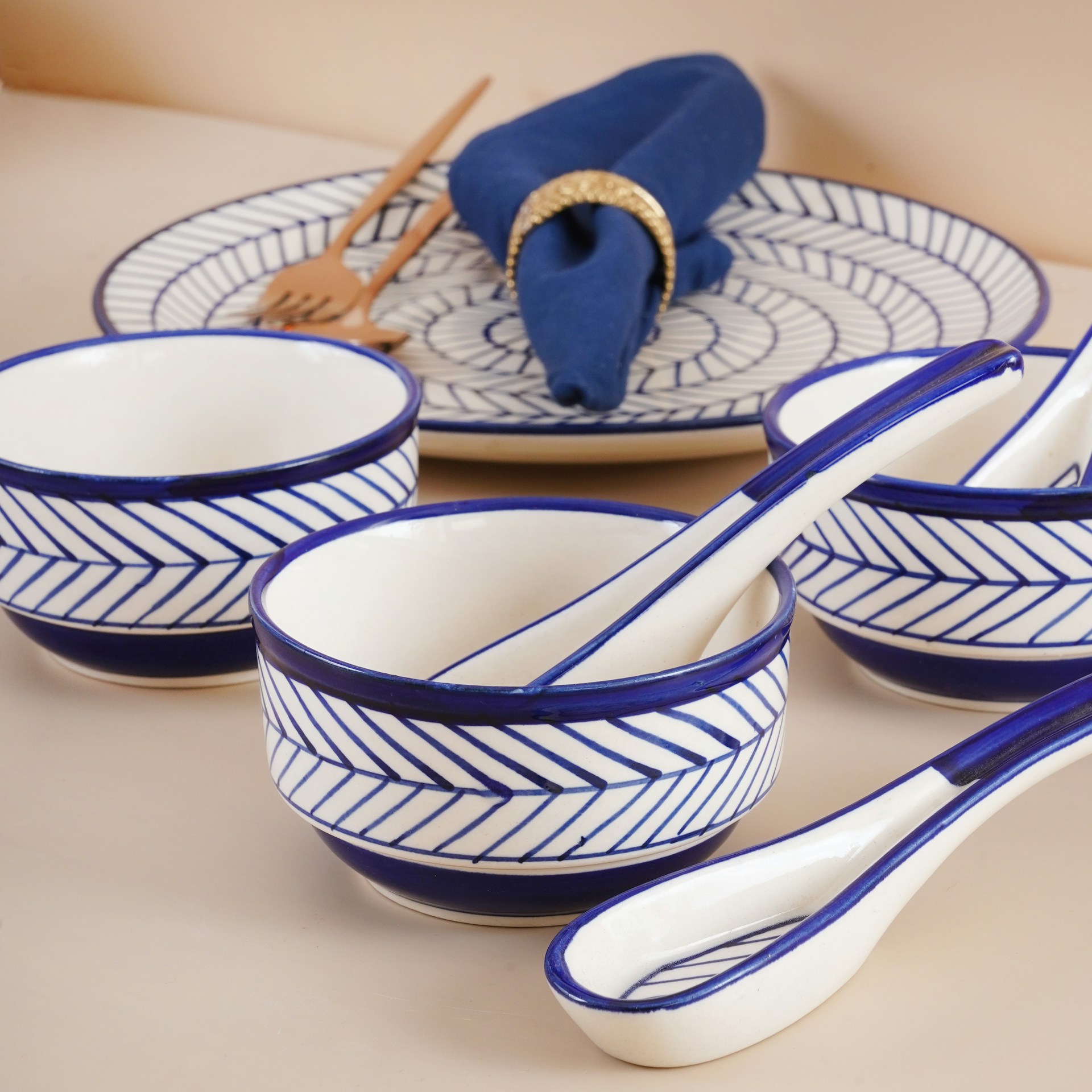 A set of blue and white dishes and spoons