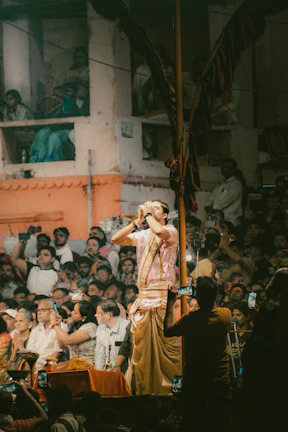A man standing on a stage in front of a crowd