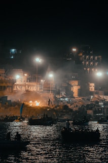 A group of boats floating on top of a body of water