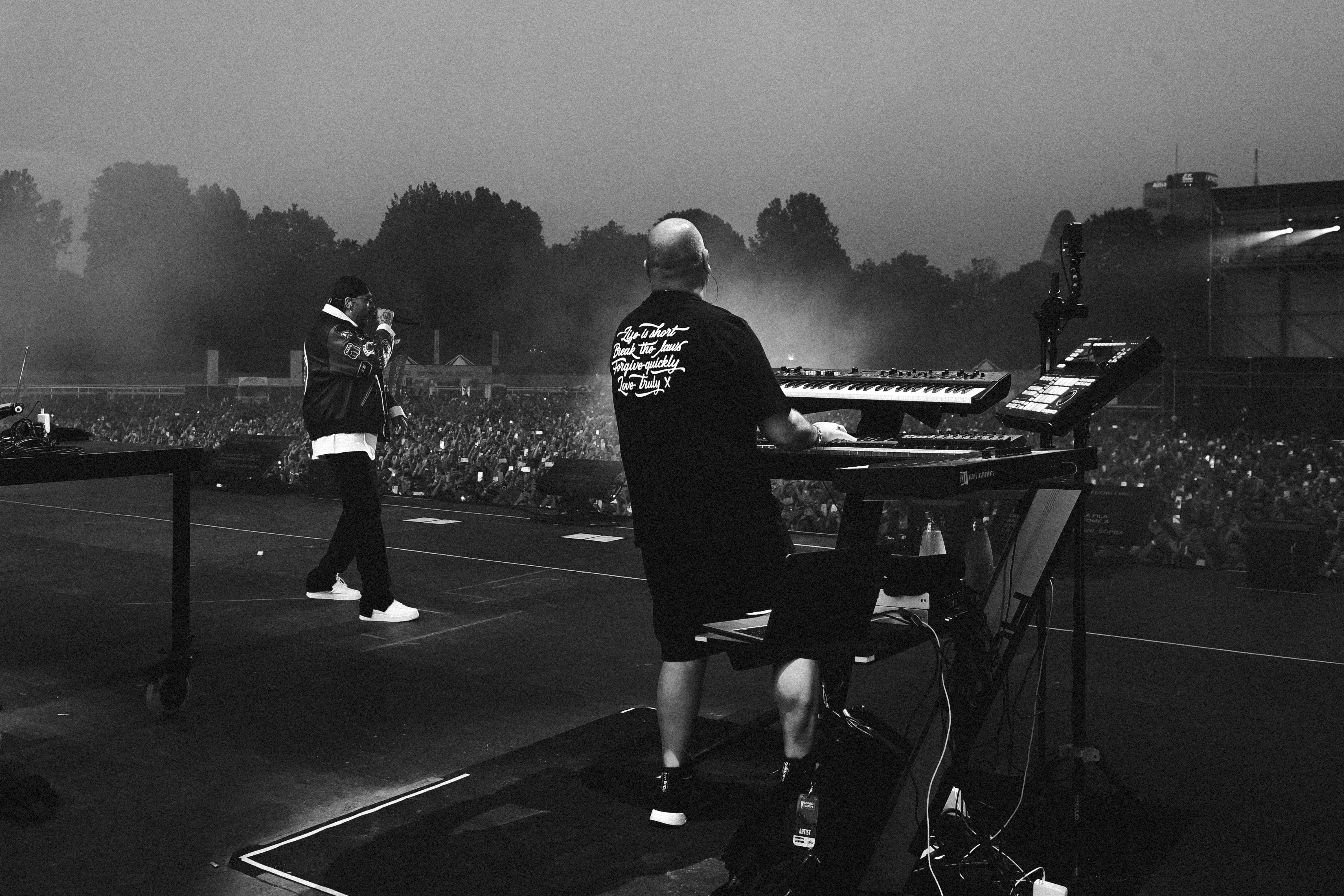 A group of men standing on top of a tennis court