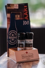 A wooden table topped with bottles of alcohol