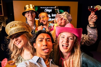 A group of people in costumes posing for a picture