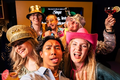A group of people in costumes posing for a picture