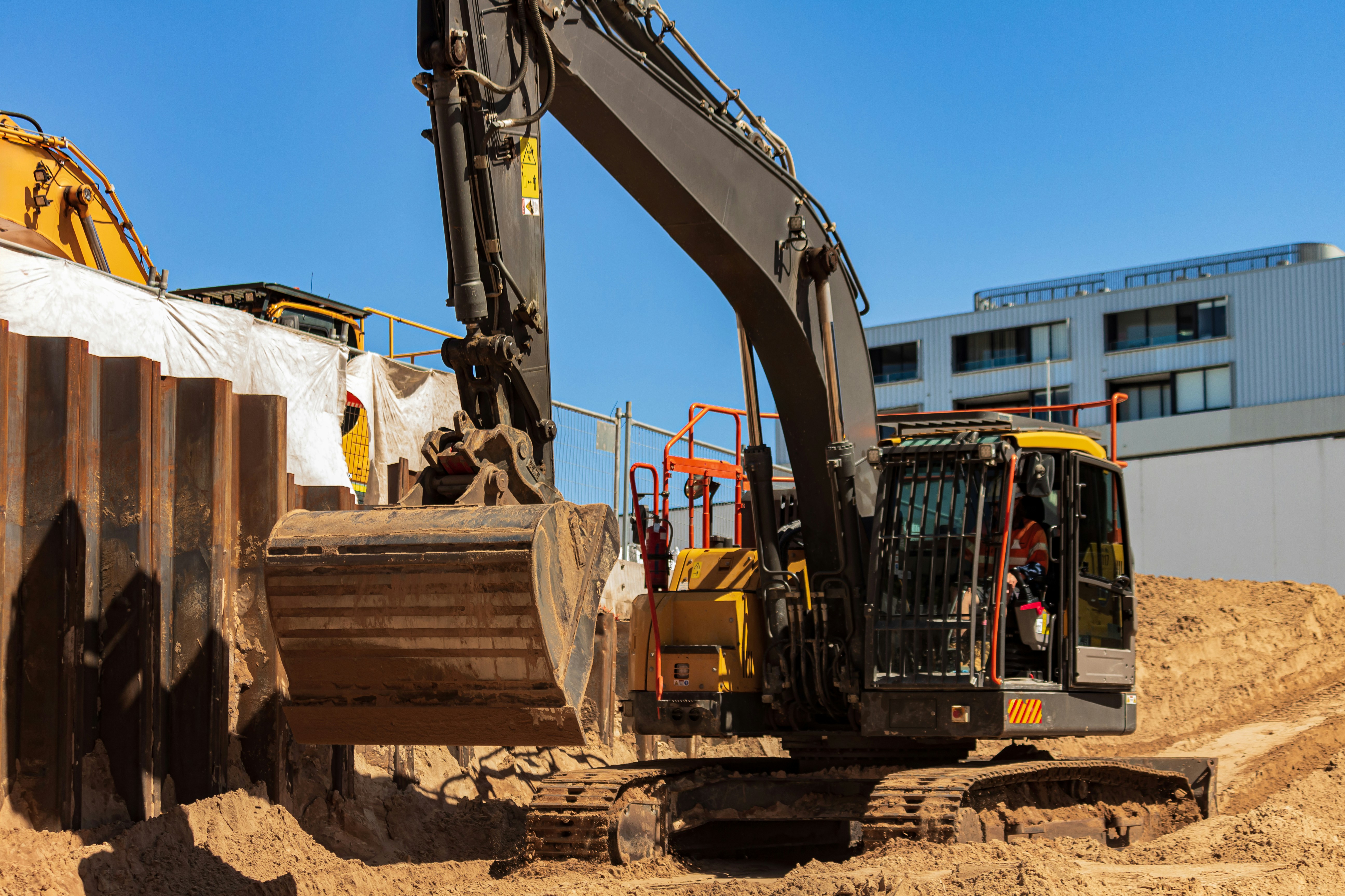 A bulldozer is parked on a construction site