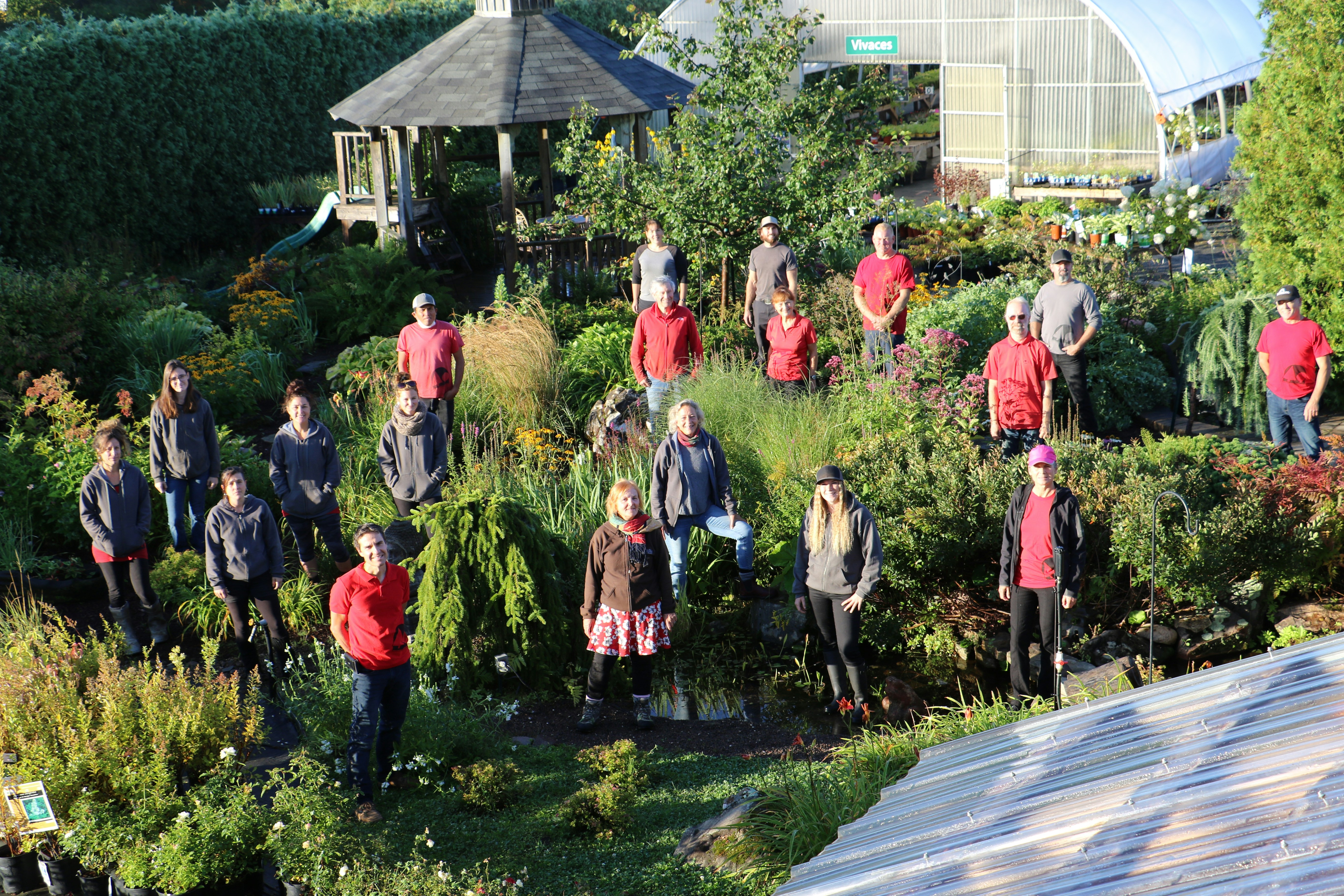 A group of people standing in a garden