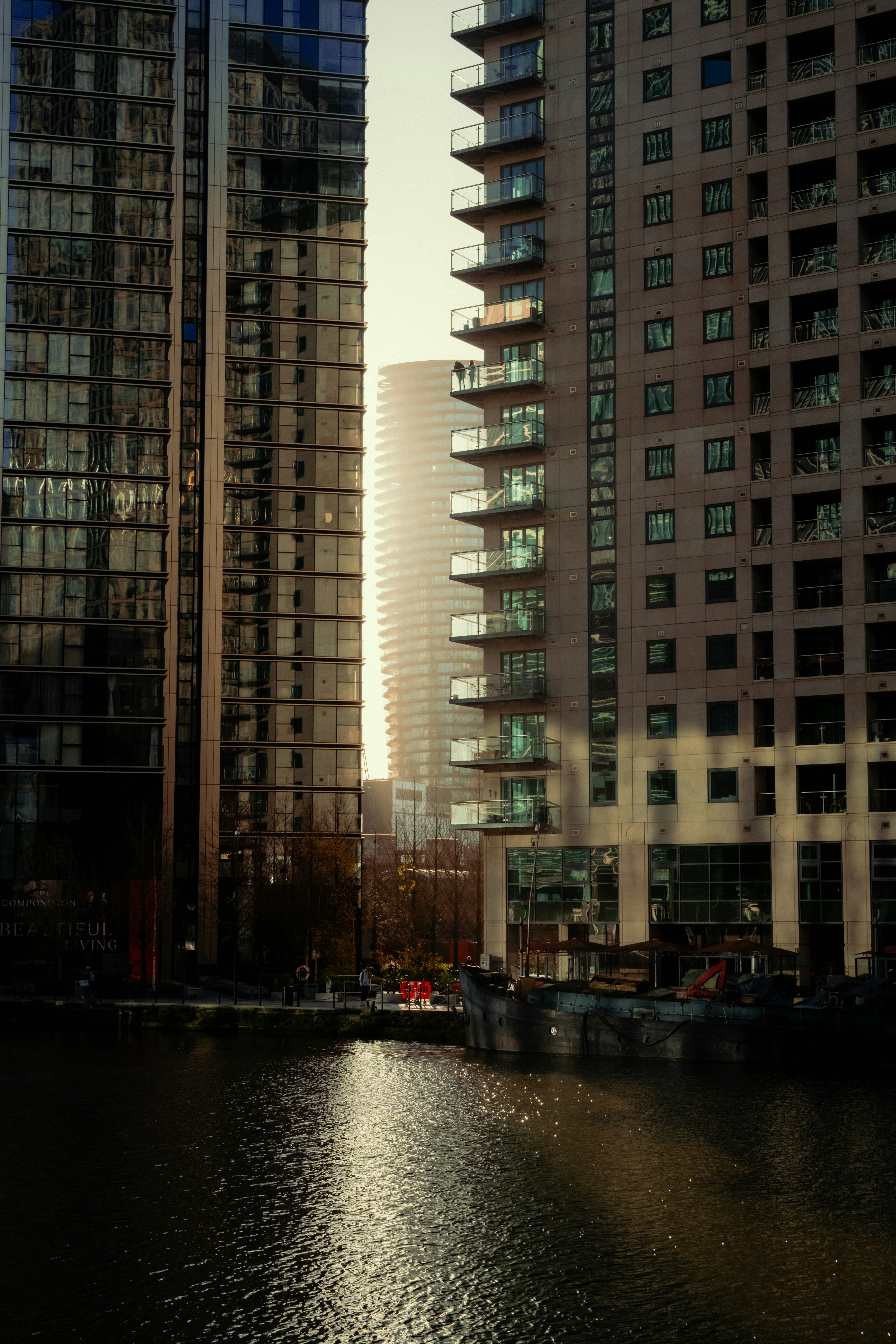 A body of water surrounded by tall buildings