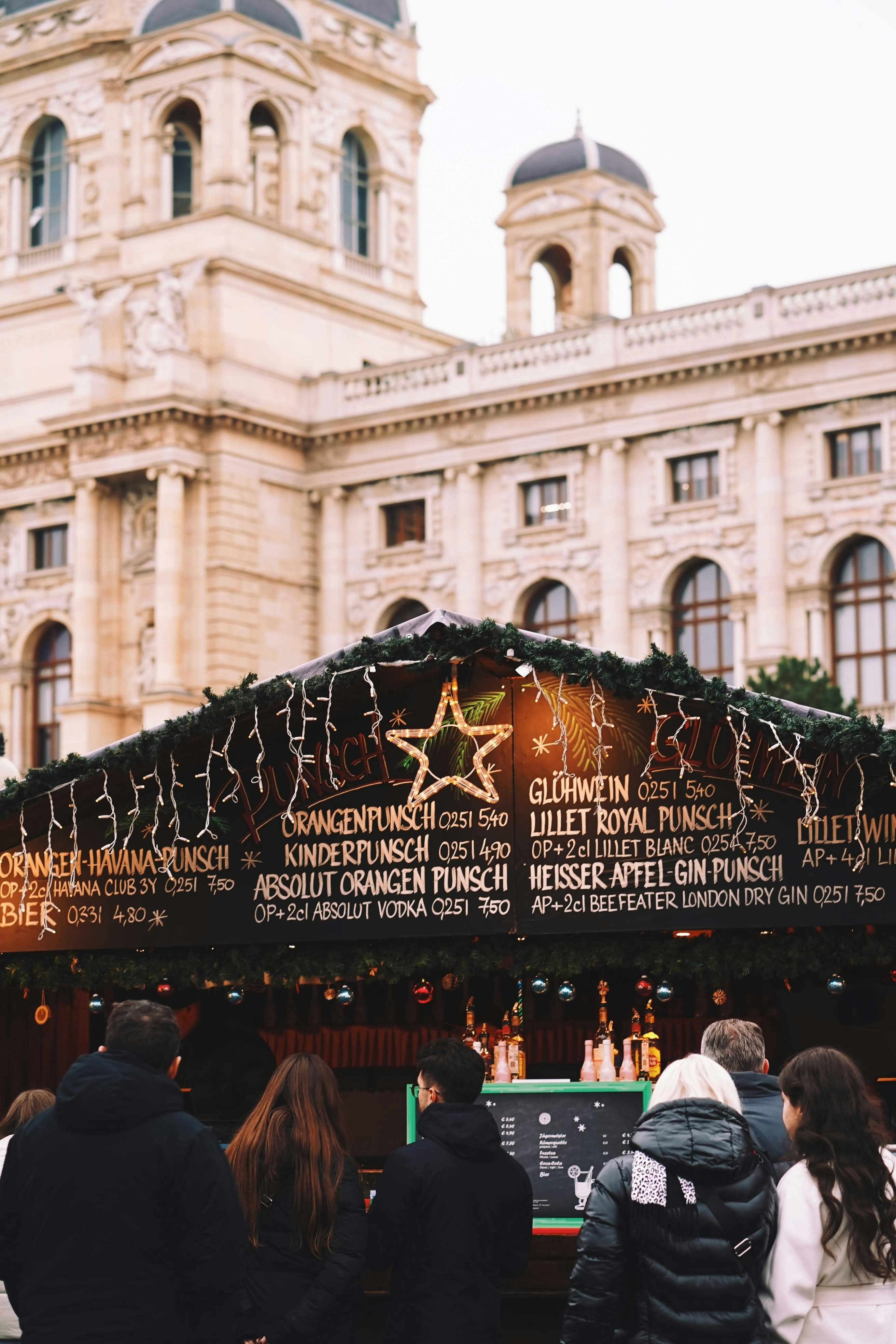 A group of people standing in front of a building