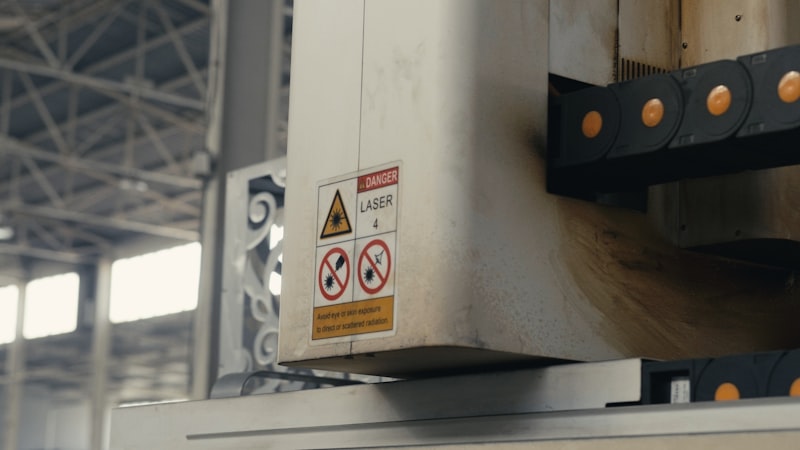 Industrial laser cutting machine operating in a factory