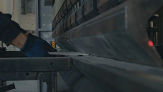 A man working on a machine in a factory
