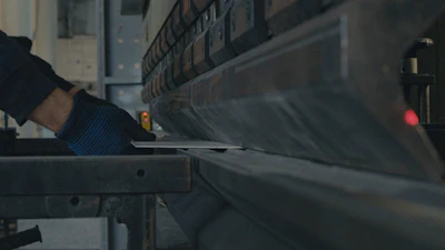A man working on a machine in a factory