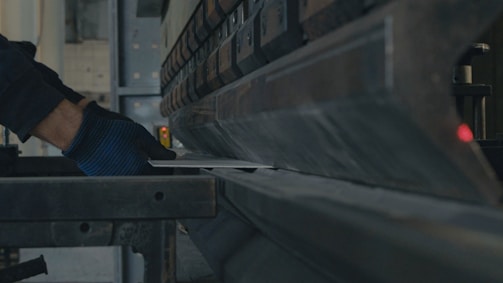 A man working on a machine in a factory