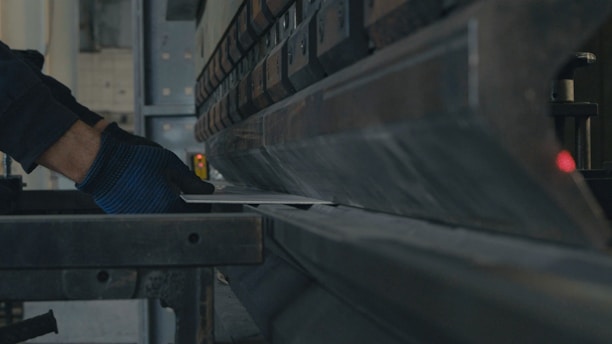 A man working on a machine in a factory
