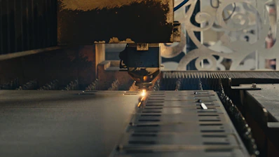 A close up of a machine cutting a piece of metal