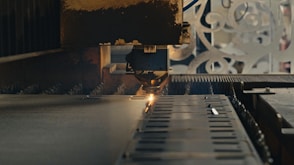A close up of a machine cutting a piece of metal