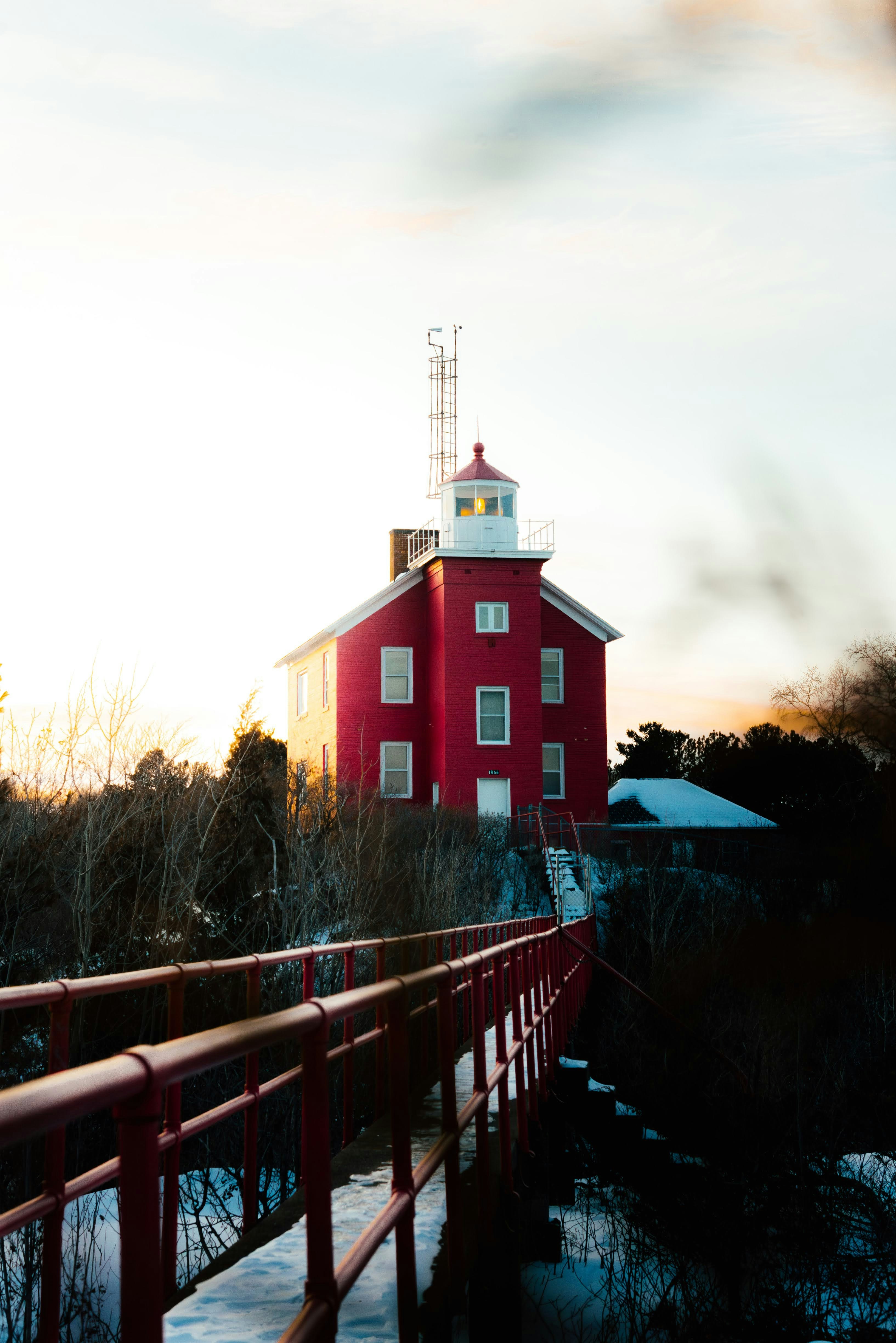 A red building with a white tower on top of it