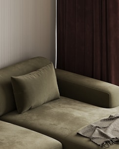 A living room with a couch and a window