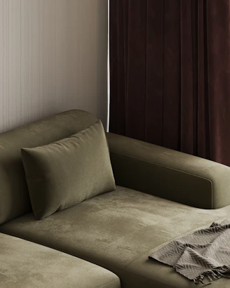 A living room with a couch and a window