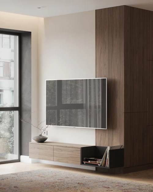 A living room with a large TV on the wall