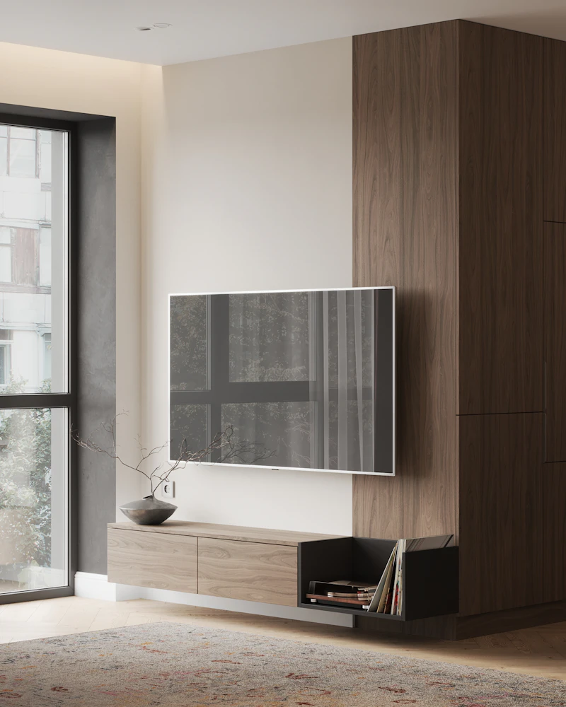 A living room with a large TV on the wall