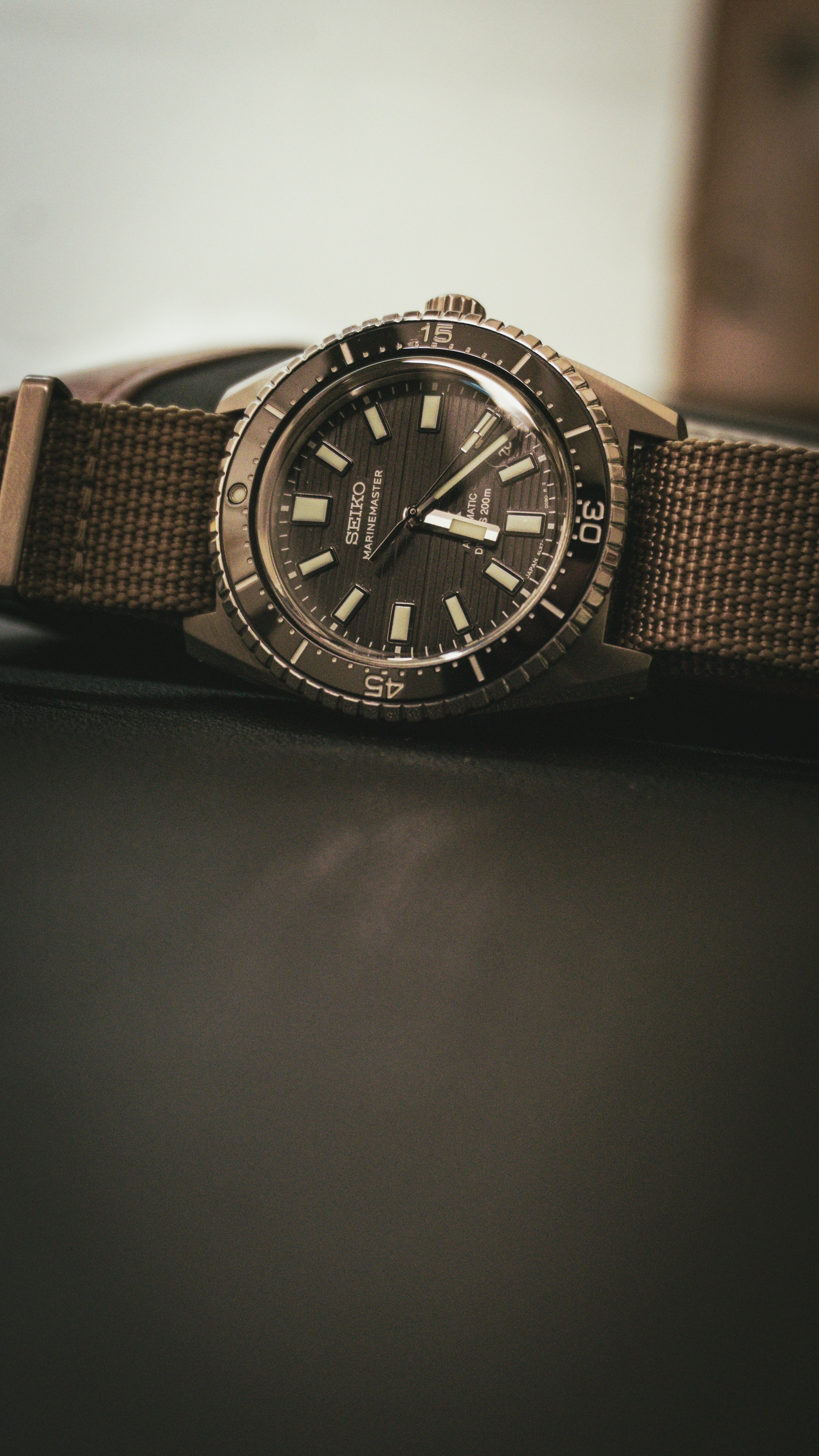 A watch sitting on top of a table