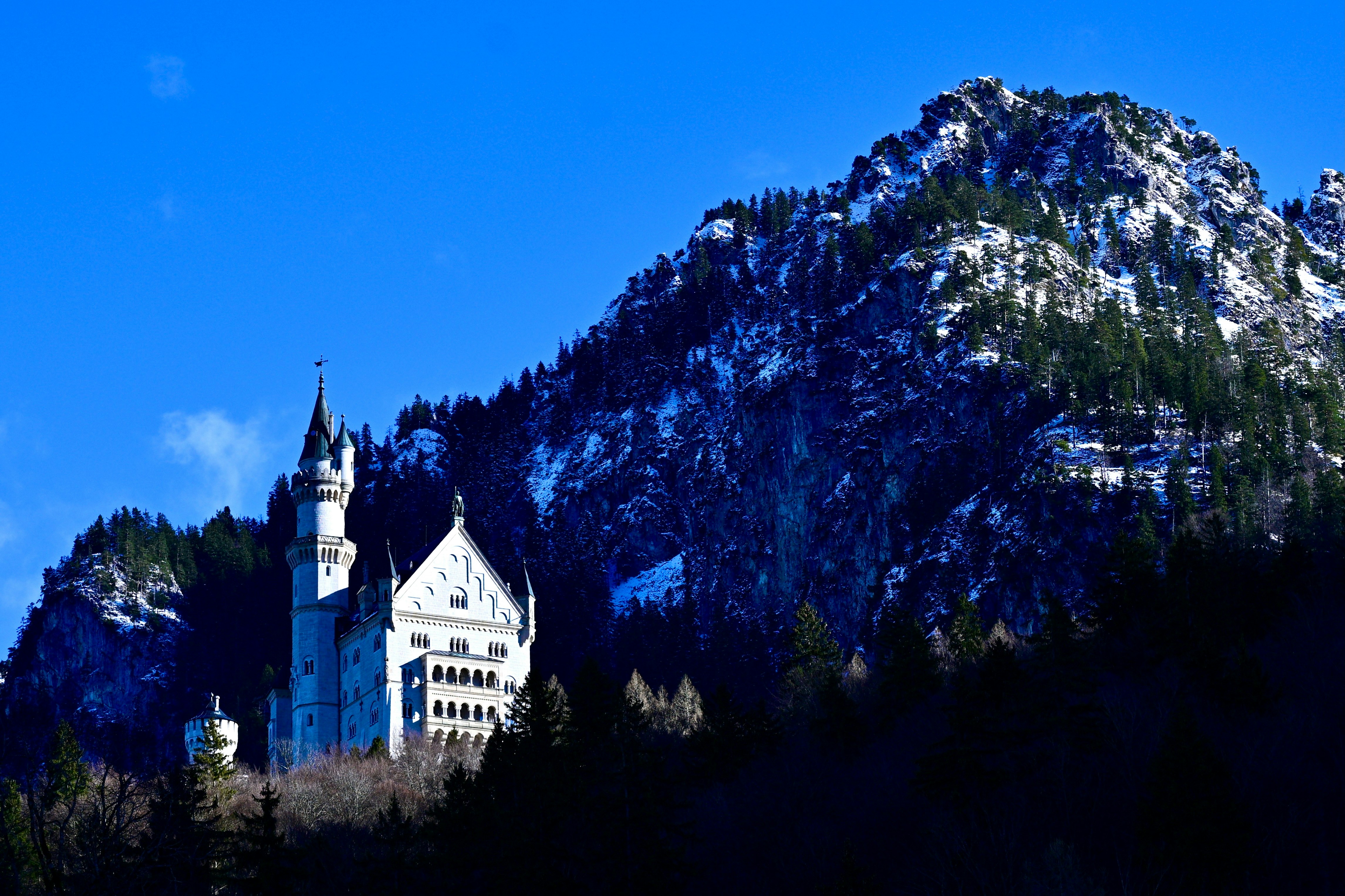 A castle in the middle of a mountain range photo – Free Castle Image on ...