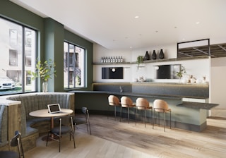 A large open kitchen and dining area with a table and chairs