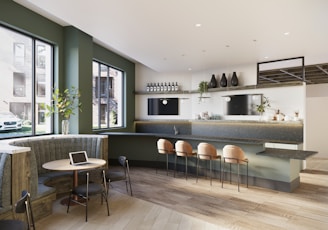 A large open kitchen and dining area with a table and chairs