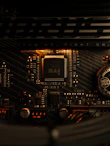 A close up of a computer motherboard with a clock